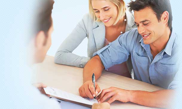Photo of people signing document